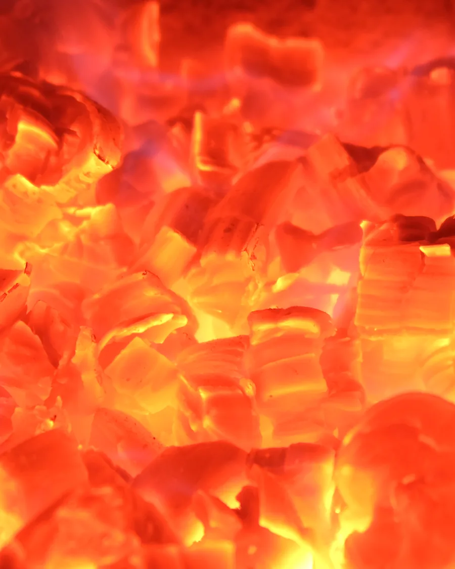 A close view of a wall of glowing embers.