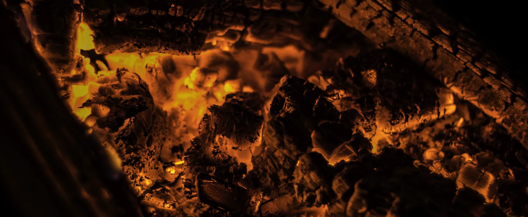Glowing coals seen close up.